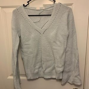 Very light blue sweater with bell sleeves